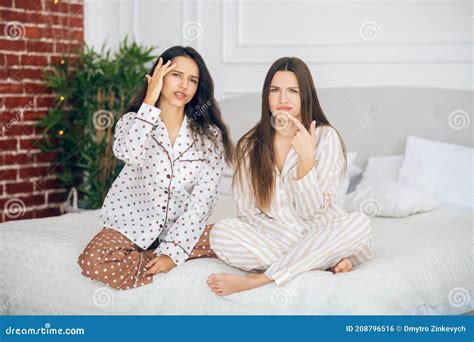Two Cute Girls In Pajamas Spending Time Together Stock Photo Image Of