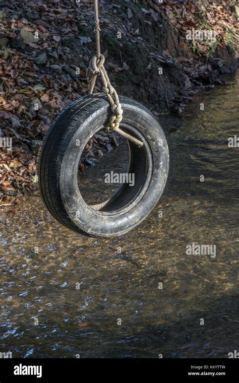 Old Car Tyre Swing Tire Swing At Rest Over A Country Stream Reminds