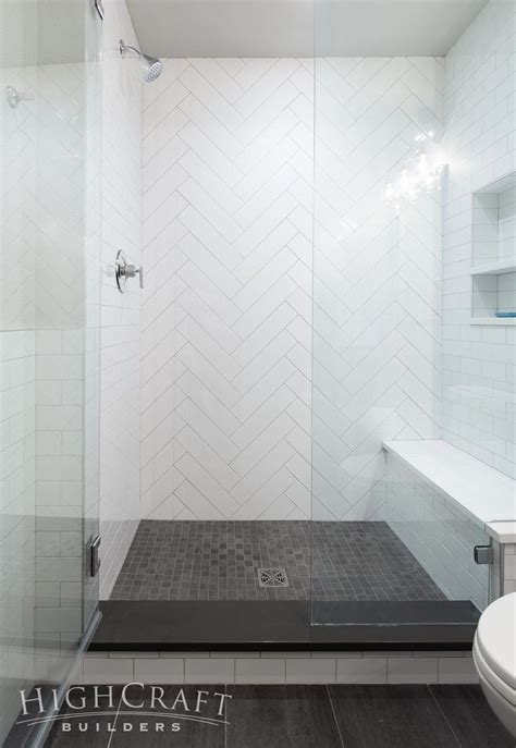 And 4×16 White Subway Tiles Create A Herringbone Accent Wall In The