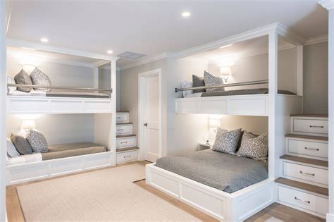 A Bedroom With Bunk Beds And Drawers In The Corner Along With Two