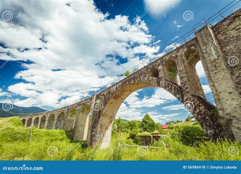 Old Stone Bridge On A Background Of Blue Sky Stock Photo Image Of
