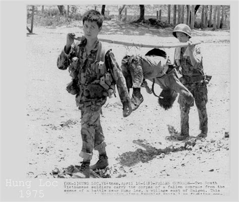 Vietnam War 1975 Two Soldiers Carry Corpse Fallen Friend Press