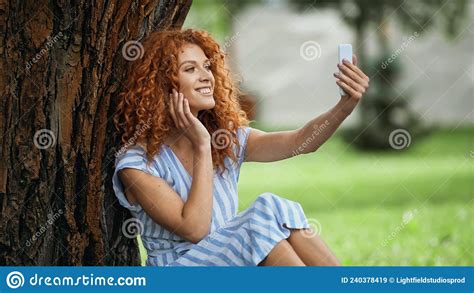 Pleased Redhead Woman Taking Selfie While Stock Image Image Of Green Device 240378419