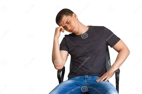 Sad Thoughtful Young Man Sitting On A Chair Propping Up The Head With