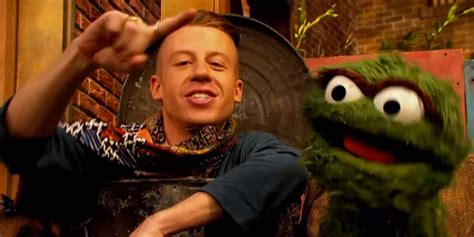 macklemore mocks thrift shop in a sesame street parody with oscar the grouch