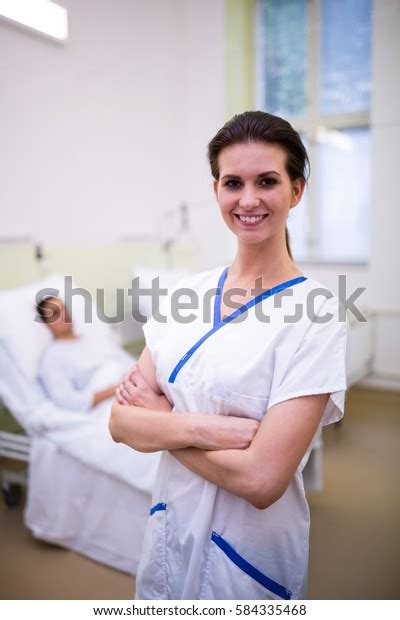 Portrait Female Nurse Standing Arms Crossed Stock Photo Edit Now