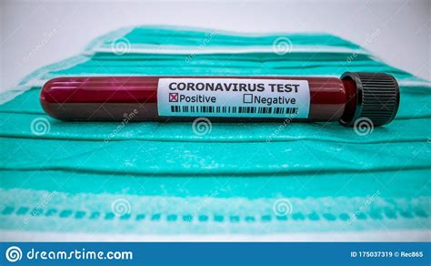 Face Mask And Test Tube With Infected Blood Sample For Virus Covid 19