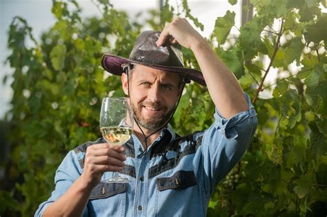 Premium Photo Happy Viticulturist Man Farmer Drink Wine At Grape Farm