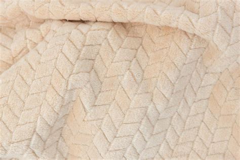 Plush Beige Blanket With Fluffy Pile And Simple Embossed Pattern Stock