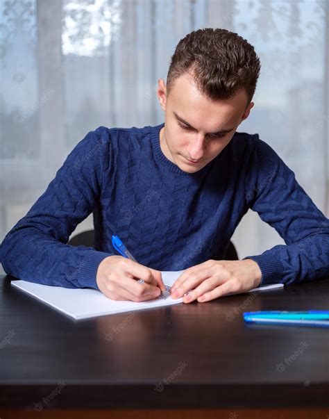 Premium Photo Student Doing Homework At Home At His Desk