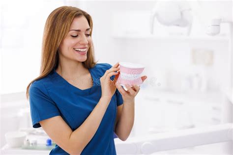 female dentist holding plastic jaw model stock image image of woman dentistry 276213585