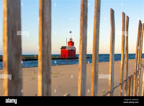 Beautiful Sunrise At Holland State Park Beach With View Of Big Red Lighthouse Holland Michigan