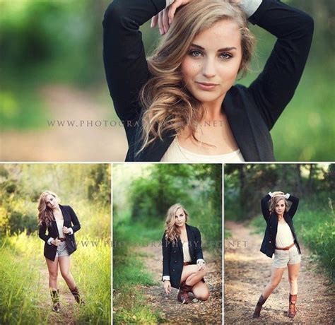 A Woman Is Posing In The Woods With Her Hands On Her Head And Wearing