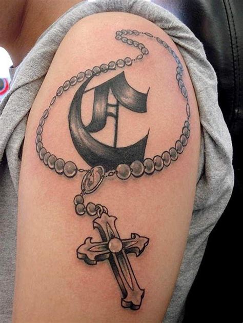 Click here to visit our gallery. 3D style cartoon like little cross tattoo on shoulder with ...