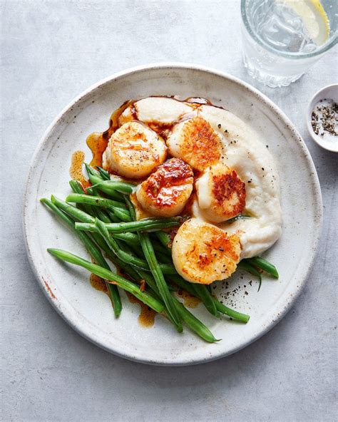 Scrumptious garlic scallops recipe, seared to perfection in a cast iron pan and cooked in a healthy clarified butter for the ultimate seafood meal! 64 Lower-calorie mains | delicious. magazine