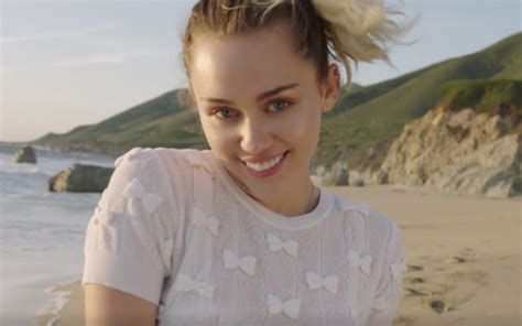 miley cyrus frolics along the beaches of malibu in her new video
