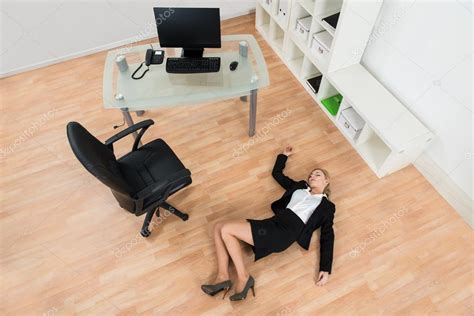Businesswoman Fainted In Office Stock Photo By Andreypopov