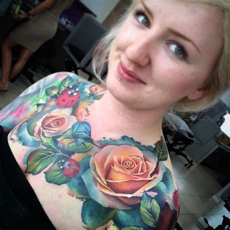 A Woman With A Flower Tattoo On Her Chest