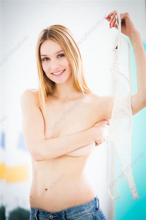 Woman Removing Her Bra Stock Image C034 1010 Science Photo Library