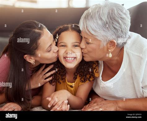 Portrait Mixed Race Child Getting Kiss On Cheek By Single Mother And