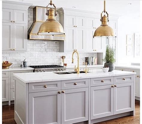 An Image Of A White Kitchen With Lots Of Counter Space And Decor On The