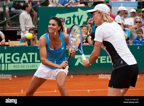 gabriela sabatini and martina navratilova playing together in a fundraising tennis doubles match