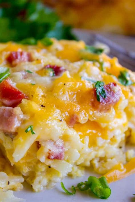 This overnight egg casserole takes just minutes to make ahead and can be refrigerated and baked in the shredded hash brown potatoes. Cheesy Overnight Hashbrown Breakfast Casserole - The Food Charlatan