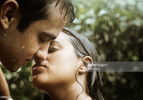 Man And Woman Kissing In Rain Photo Getty Images