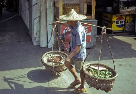 Free Vintage Stock Photo Of Man Carrying Baskets Vsp