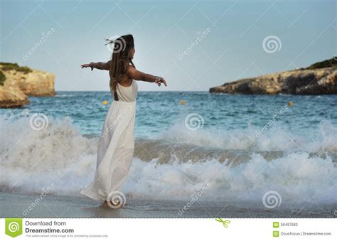 Woman Looking Thoughtful At Sea Water In Summer Holiday Enjoying Vacation Relaxed Wearing White