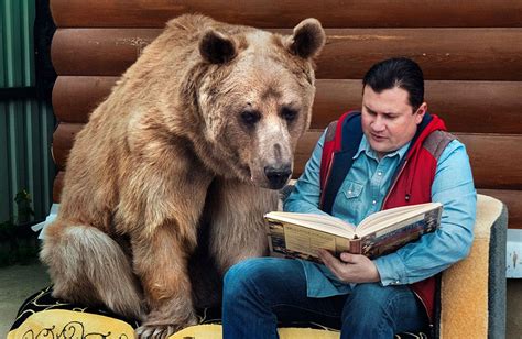 Russian Couple Adopted An Orphaned Bear 23 Years Ago And They Still