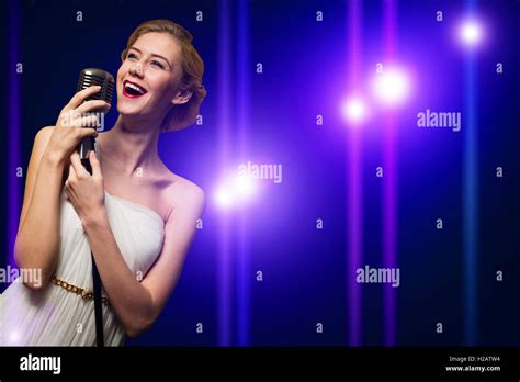 Attractive Female Singer With Microphone Stock Photo Alamy