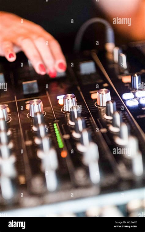 Detail Of Woman Dj Hands Mixing On Console Close Up Of Music Mixing