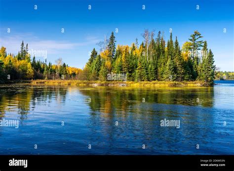 Fall Foliage Color And Reflections In A Small Lake In Quetico