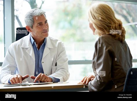 Doctor Consulting Patient In Clinic Stock Photo Alamy