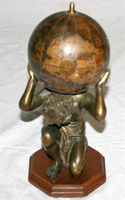 Sculpture Of A Man Holding The World 12 Tall
