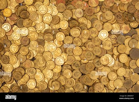 Bed Of Small Golden Coins Stock Photo Alamy