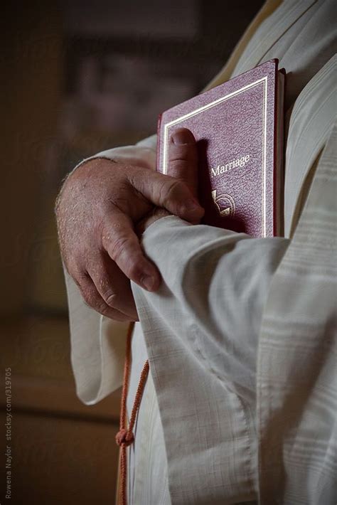 Priest Clasping Bible By Stocksy Contributor Rowena Naylor Naylor Marriage Ceremony Ceremony