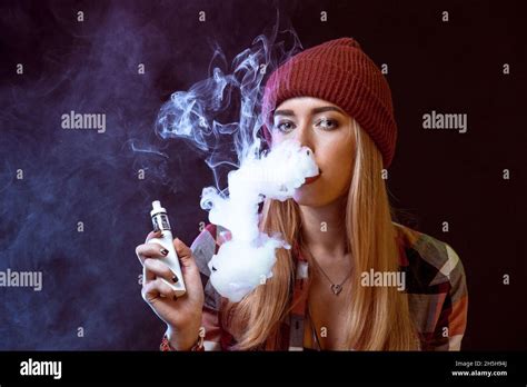 Young Woman Smoking Electronic Cigarette Stock Photo Alamy