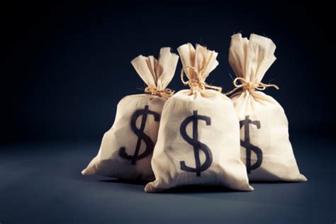 Bags Full Of Money On A Dark Background Stock Photo Download Image