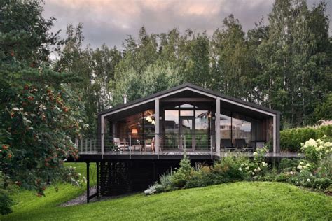 A Rustic Modular House On Top Of A Small Forest Slope