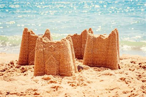 Sand Castle With Towers On The Beach With View On The Sea Holiday Concept With Sand Castle