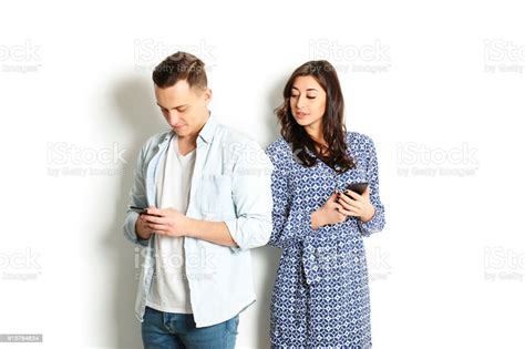 Jealous Wife Spying Her Husband Mobile Phone While He Is Reading A