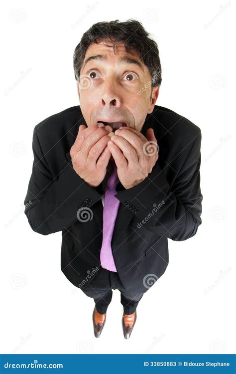 Scared Businessman Full Height In Desperate Pose And Giant Hand