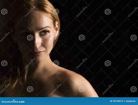 Portrait Of Beautiful Sensuality Pensive Woman Profile Wit In A Dark