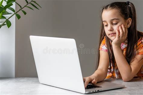 Cute Little Girl Smiling And Looking At Laptoplittle Girl Using Laptop