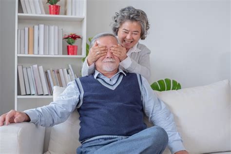 Premium Photo Senior Couple Wife Teasing Husband In House