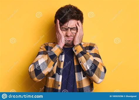 Handsome Caucasian Guy Suffering From Stress And Headache Against