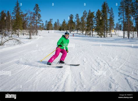 Finland Lapland Levi Portrait Of Mid Adult Woman Skiing Stock Photo