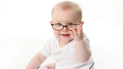 Cute Child With Specs Wearing White Dress In White